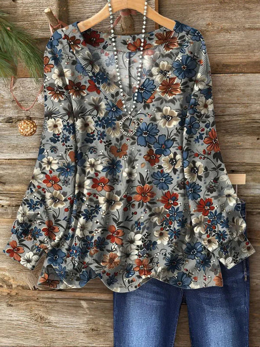 Comfortabele blouse met diepe V-hals en felle bloemenprint